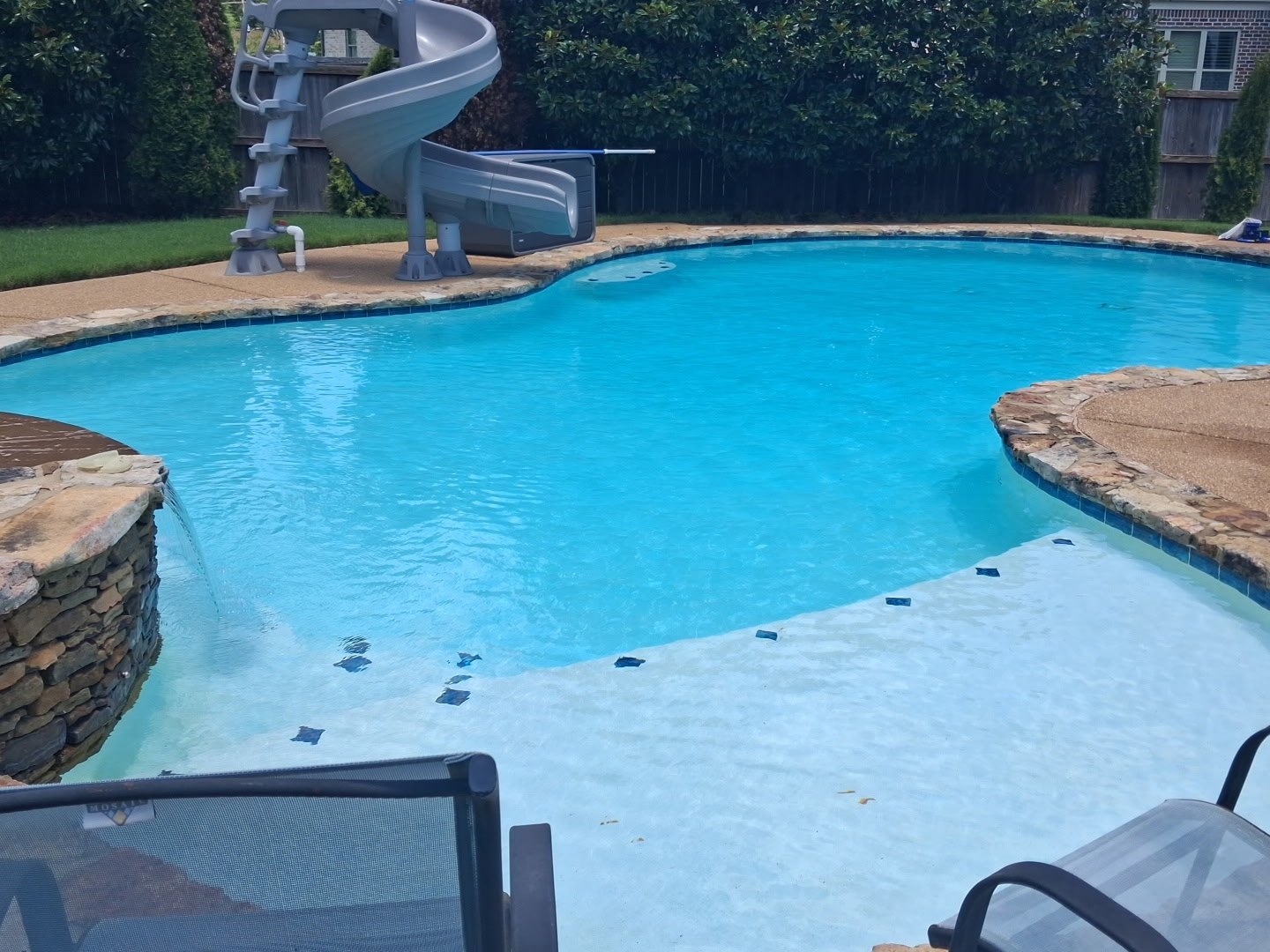 Clean swimming pool with slide